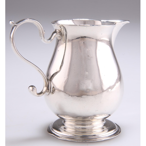 1090 - A GEORGE II SILVER SPARROW-BEAK CREAM JUG by Ralph Maidman, London 1733, of baluster form, engraved ... 