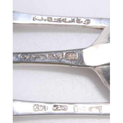 1174 - A GROUP OF SIX 18TH CENTURY SILVER OLD ENGLISH PATTERN TABLE SPOONS London marks, four engraved. (6)... 