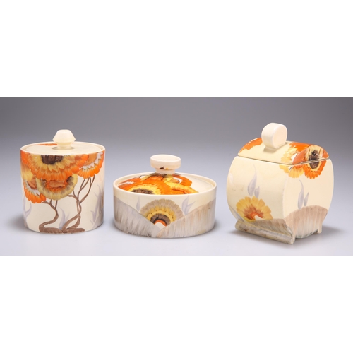 133 - THREE CLARICE CLIFF BIZARRE RHODANTHE PATTERN POTS AND COVERS comprising A BONJOUR PRESERVE POT, 10.... 