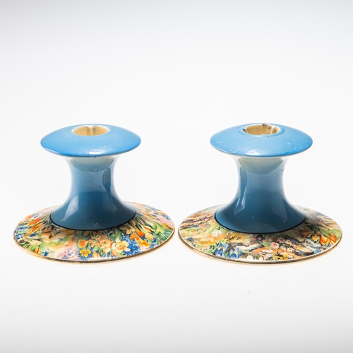 141 - A PAIR OF CLARICE CLIFF CANDLESTICKS shaped 310, with transfer printed floral decoration, Newport po... 