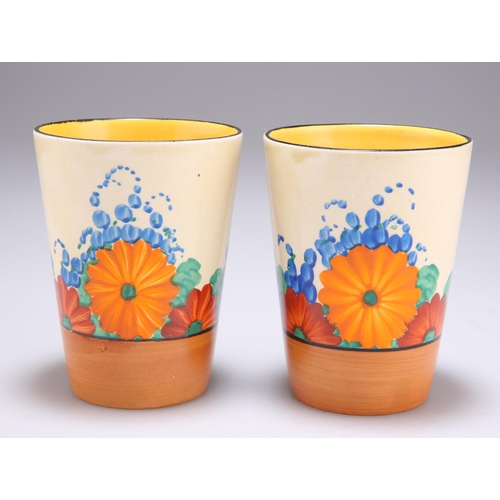 148 - A PAIR OF CLARICE CLIFF BIZARRE GAYDAY PATTERN BEAKERS Newport pottery backstamps. (2) 9.5cm highBot... 