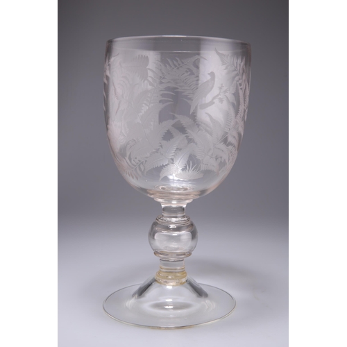 46 - A VICTORIAN GLASS GOBLET the bucket bowl engraved with ferns, birds and butterflies, to a waisted kn... 