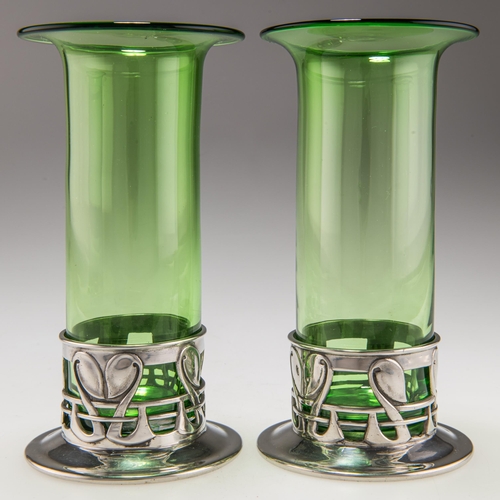 70 - ARCHIBALD KNOX (1864-1933), A RARE PAIR OF LIBERTY & CO TUDRIC PEWTER VASES nos. 0441, each with a g... 