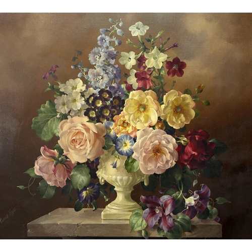 2179 - ‡ HAROLD CLAYTON (BRITISH 1896-1979) STILL LIFE OF FLOWERS IN AN URN ON A LEDGE Signed
Oil on canvas... 