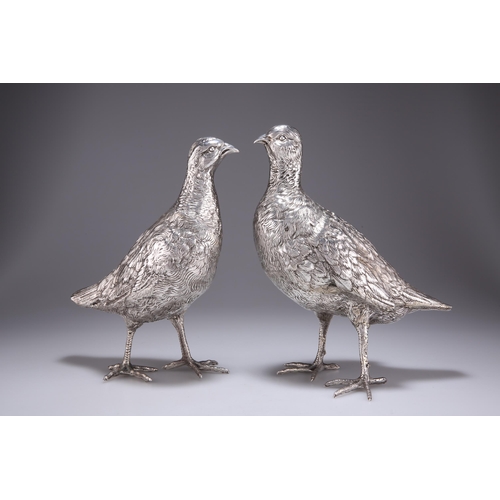 1060 - A PAIR OF CONTINENTAL SILVER GROUSE TABLE ORNAMENTS c.1920, each realistically modelled, with chased... 