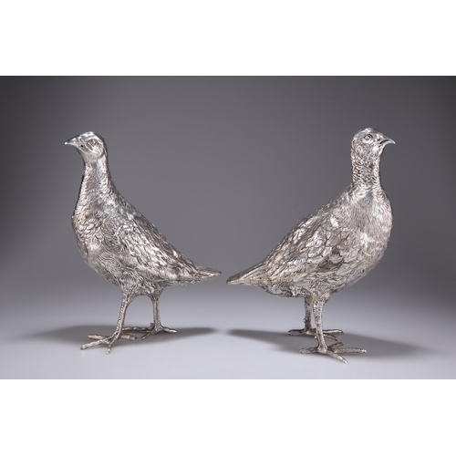 1060 - A PAIR OF CONTINENTAL SILVER GROUSE TABLE ORNAMENTS c.1920, each realistically modelled, with chased... 