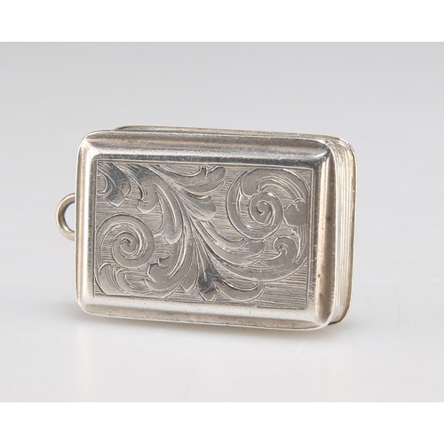 1056 - AN EARLY VICTORIAN SILVER VINAIGRETTE by Nathaniel Mills, Birmingham 1843, rectangular, with scrolle... 