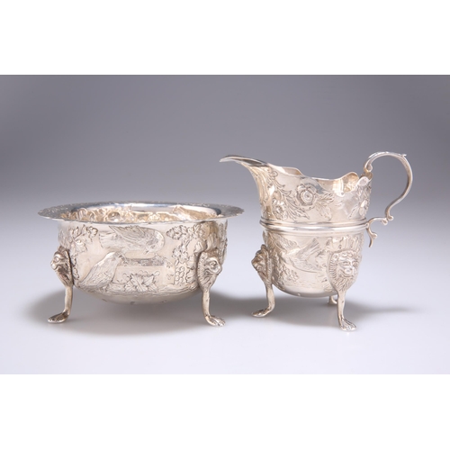 1401 - AN IRISH SILVER CREAM JUG AND SUGAR BOWL by John Smyth, Dublin 1901, in 18th Century style, chased w... 