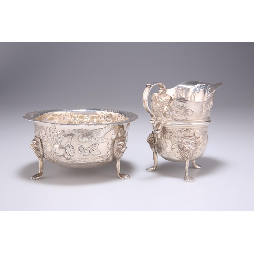 1401 - AN IRISH SILVER CREAM JUG AND SUGAR BOWL by John Smyth, Dublin 1901, in 18th Century style, chased w... 