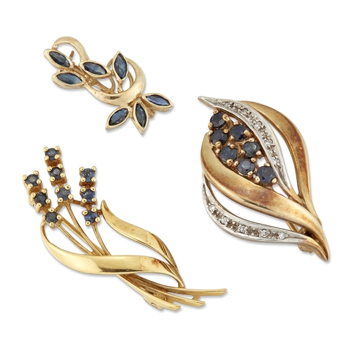 2124 - THREE BROOCHES comprising A 9 CARAT GOLD SAPPHIRE AND DIAMOND SCROLL BROOCH, hallmarked London 1987,... 