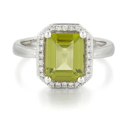 2126 - A PLATINUM PERIDOT AND DIAMOND CLUSTER RING an octagonal-cut peridot within a conforming border of r... 