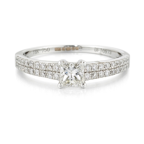 2475 - AN 18 CARAT WHITE GOLD PRINCESS-CUT DIAMOND RING a princess-cut diamond to diamond-set shoulders. Es... 