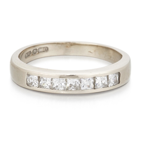 2482 - AN 18 CARAT WHITE GOLD WHITE PASTE HALF-HOOP RING princess-cut paste in a channel setting. Hallmarke... 