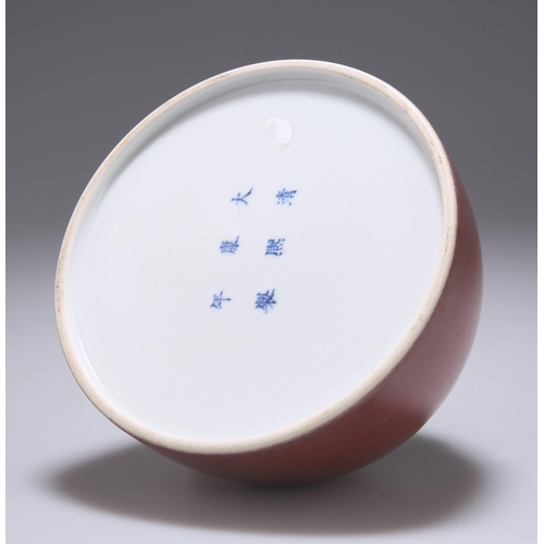 124 - A CHINESE PEACH BLOOM BRUSHWASHER of domed circular form, bears underglaze blue six character mark. ... 