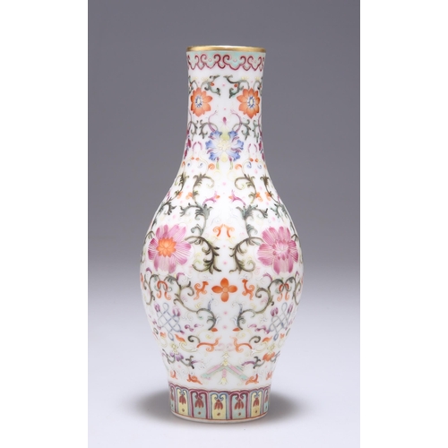 129 - A CHINESE FAMILLE ROSE VASE enamel painted with lotus flowers and scrolling tendrils, bears undergla... 