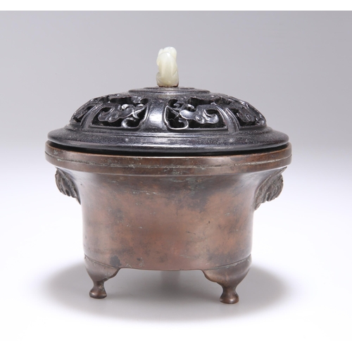 139 - A CHINESE JADE-MOUNTED BRONZE CENSER the carved and pierced hardwood cover with carved jade monkey f... 