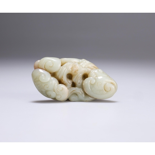 147 - A CHINESE JADE CARVING with scrolling tendrils, ruyi heads and a bat. 9cm wide