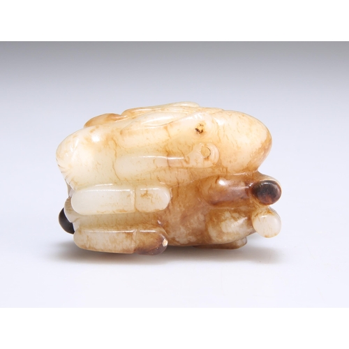 150 - A CHINESE CARVED JADE GROUP depicting a recumbant crane and deer. 5cm long, 4cm high