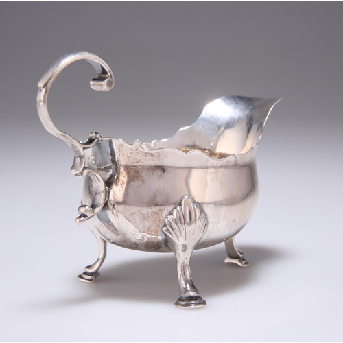 232 - A GEORGE III SILVER CREAM BOAT by Joseph Steward (probably), London 1768, of deep-bellied form with ... 