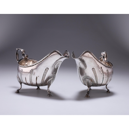 285 - A PAIR OF EDWARDIAN SILVER SAUCE BOATS, IN GEORGE III IRISH STYLE by Daniel & John Wellby, Londo... 