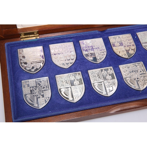 29 - ROYAL INTEREST: A SET OF TWELVE ELIZABETH II SILVER INGOTS, 