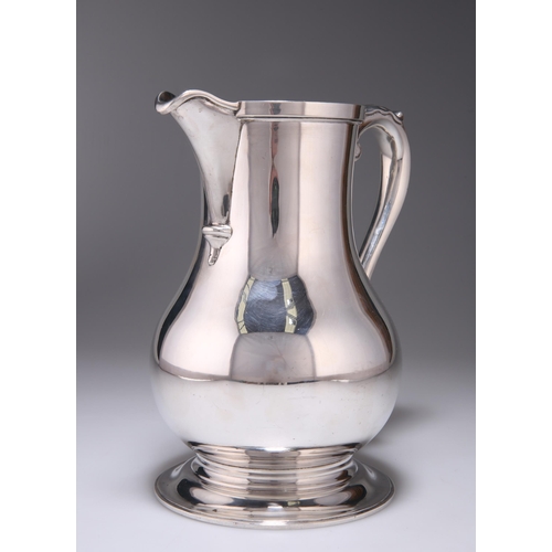 307 - AN ELIZABETH II SILVER BEER JUG by Wakely & Wheeler, London 1972, plain baluster form, the beak-... 