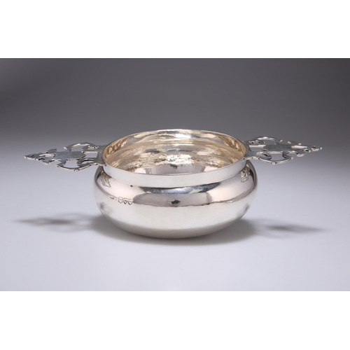 325 - A VICTORIAN SILVER QUAICH by Susannah Brasted, London 1892, of bellied circular form with twin pierc... 