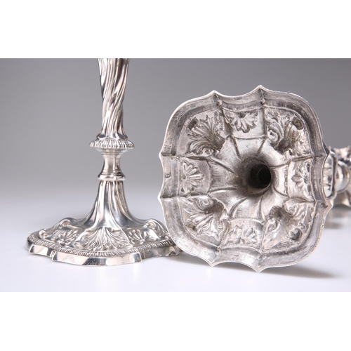 366 - A PAIR OF GEORGE III SILVER CANDLESTICKS by Ebenezer Coker (probably), London 1768, each with a deta... 