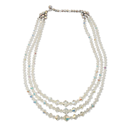 411 - TWO NECKLACES comprising a triple strand crystal bead necklace, 50cm long; and a simulated pearl col... 