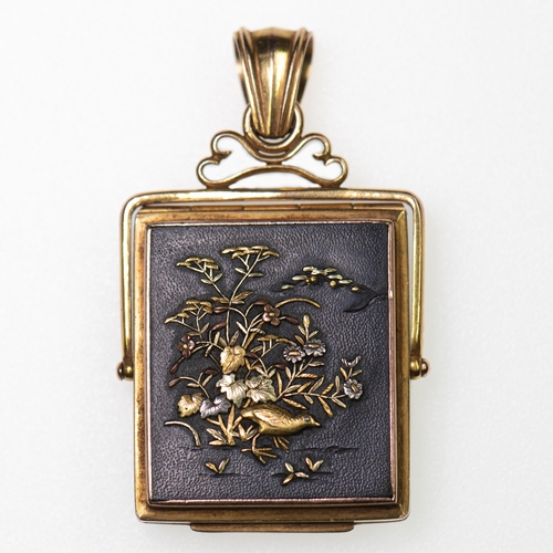 530 - AN EARLY 20TH CENTURY JAPANESE SHAKUDO SWIVEL LOCKET PENDANT rectangular form, decorated with a bird... 