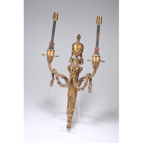 711 - A SET OF FOUR GILT-BRONZE WALL LIGHTS, 18TH/19TH CENTURY each with a pair of reeded branches draped ... 