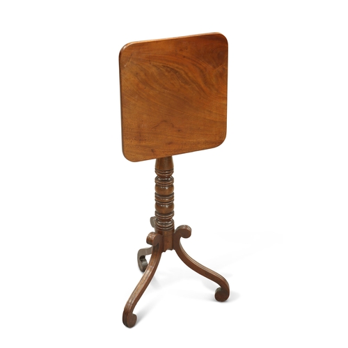 735 - A REGENCY MAHOGANY TILT-TOP TRIPOD TABLE the square top with rounded corners, raised on a ring-turne... 