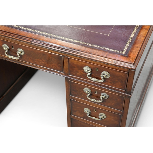 750 - AMENDMENT - A MAHOGANY PARTNER'S DESK the moulded rectangular top with gilt-tooled leather-inset wri... 