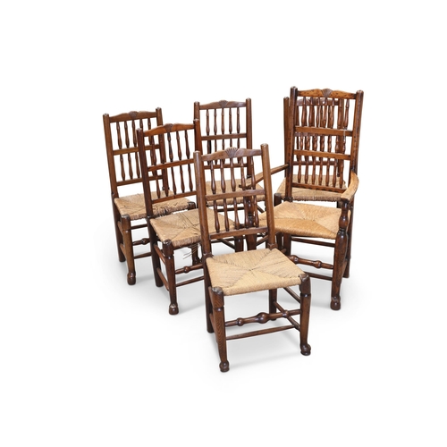 754 - A SET OF SIX EARLY 19TH CENTURY OAK SPINDLE-BACK DINING CHAIRS, OF LANCASHIRE ORIGIN including one c... 