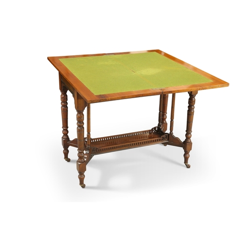 832 - A LATE VICTORIAN WALNUT FOLDOVER CARD TABLE the moulded top opening to reveal a green baize playing ... 