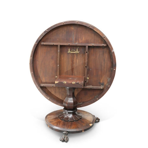 842 - A 19TH CENTURY ROSEWOOD TILT-TOP BREAKFAST TABLE the moulded circular top raised on a faceted balust... 