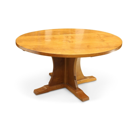 887 - ROBERT THOMPSON OF KILBURN, A MOUSEMAN OAK DINING TABLE the adzed circular top raised on a cruciform... 