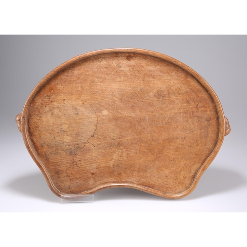 888 - ROBERT THOMPSON OF KILBURN, A MOUSEMAN OAK TEA TRAY kidney-shaped, adzed, with carved mouse signatur... 