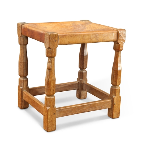 889 - ROBERT THOMPSON OF KILBURN, A 1930S MOUSEMAN OAK STOOL rectangular, the tan leather seat raised on f... 