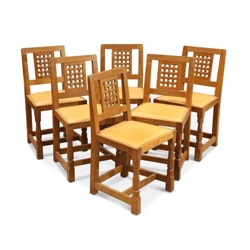 893 - ROBERT THOMPSON OF KILBURN, A SET OF SIX MOUSEMAN OAK DINING CHAIRS each with lattice-back, raised o... 