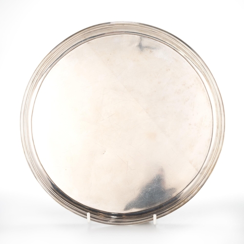 186 - A GEORGE III SILVER SALVER mark of Solomon Hougham overstriking, London 1794, plain circular form, w... 