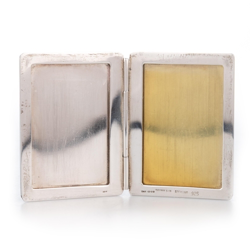 193 - TIFFANY & CO: AN AMERICAN STERLING SILVER DOUBLE PHOTOGRAPH FRAME London import mark, 1991, hinged p... 