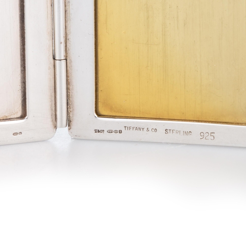 193 - TIFFANY & CO: AN AMERICAN STERLING SILVER DOUBLE PHOTOGRAPH FRAME London import mark, 1991, hinged p... 