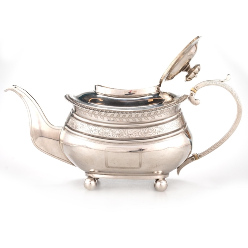 201 - § A GEORGE III SILVER TEAPOT probably by Naphtali Hart, London 1815, engraved with vine leaf frieze ... 
