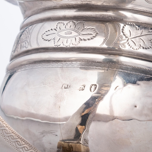 201 - § A GEORGE III SILVER TEAPOT probably by Naphtali Hart, London 1815, engraved with vine leaf frieze ... 