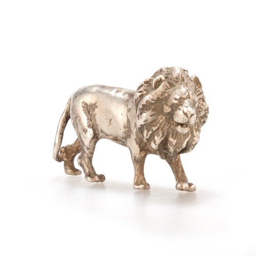 207 - PATRICK MAVROS: A SILVER SCULPTURE OF A LION by Patrick Mavros, Zimbabwe, cast standing. 3.5cm wideI... 