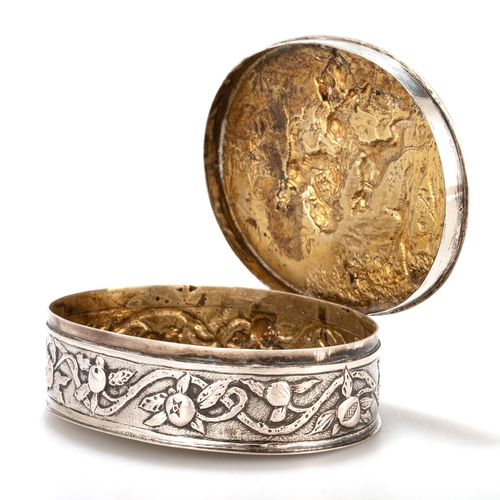 214 - A GERMAN SILVER BOX, LATE 19TH CENTURY Hanau, oval, the hinged cover chased a scene depicting a bear... 