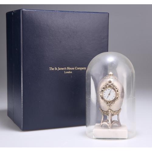 222 - AN ELIZABETH II SILVER EASTER EGG CLOCK by St James House Company, London 1983, the small round cloc... 