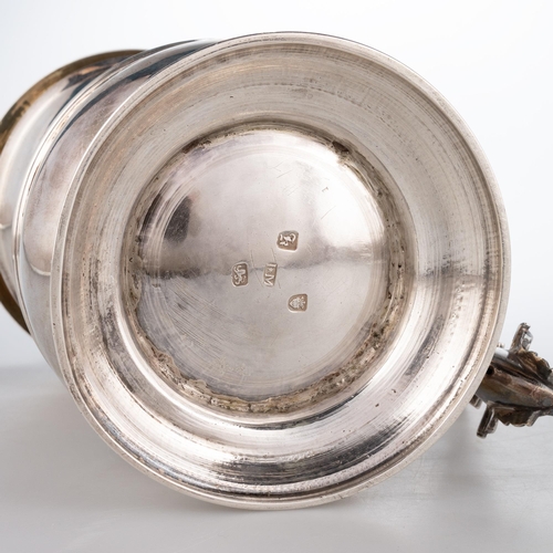 227 - AN EARLY GEORGE III SILVER LIDDED TANKARD maker I*M, London 1765, of baluster form, the hinged domed... 