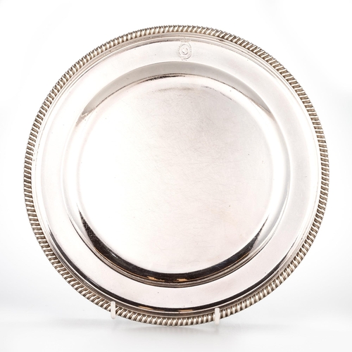 230 - A SET OF TWELVE GEORGE III SILVER DINNER PLATES by James Young, London 1791, circular with gadrooned... 